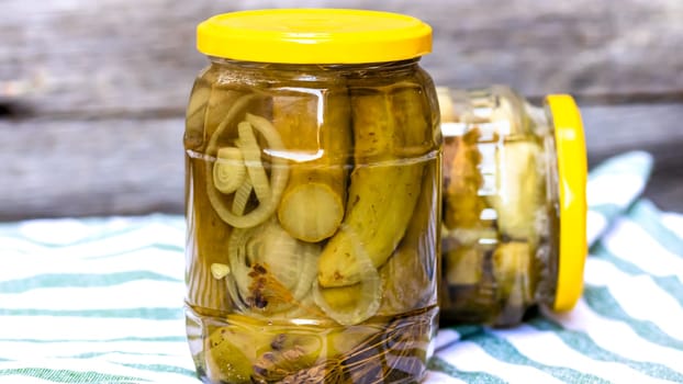 Glass jar with pickles isolated. Preserved food concept, canned vegetables isolated in a rustic composition.