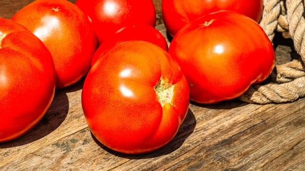 Close up of fresh ripe tomatoes isolated in a rustic composition,