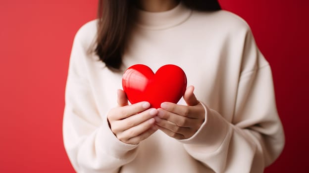 Girl holding a bright red heart symbol - Love concept - Generative AI