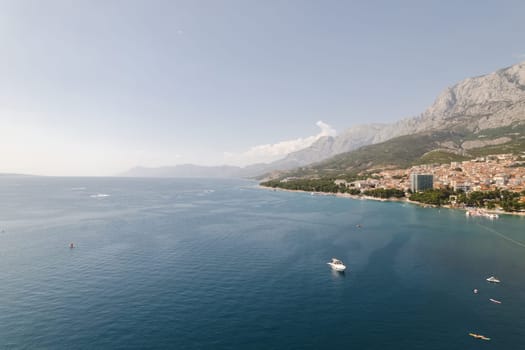 Makarska Peninsula in Croatia offers breathtaking views of Adriatic Sea. Adriatic Sea is surrounded by lush greenery, creating serene and peaceful atmosphere.