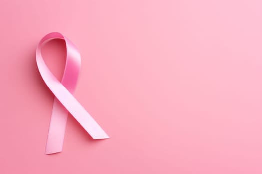 Pink cancer awareness ribbon, pink background. Generative AI.