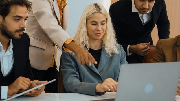 Diverse office worker employee working and brainstorm on strategic business marketing planning. Teamwork and positive attitude create productive and supportive in ornamented business office workplace.