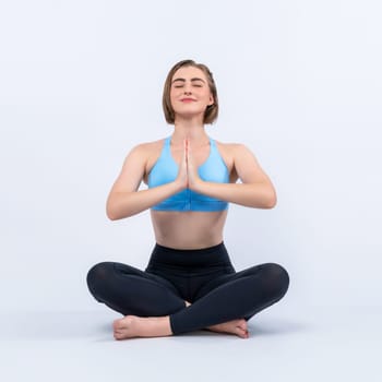 Full body length gaiety shot athletic and sporty woman doing healthy and meditative yoga exercise workout posture on isolated background. Healthy active and body care lifestyle