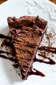 Chocolate Crepe Cake with Chocolate Sauce on top. Selective focus.
