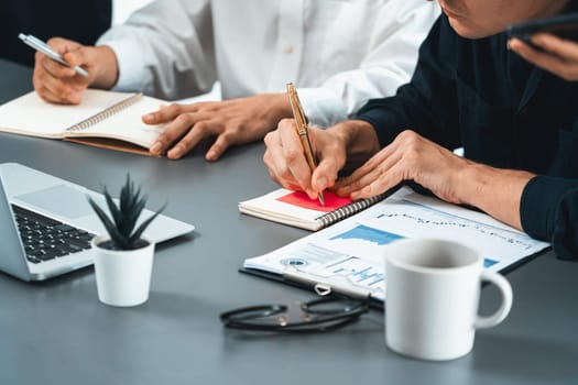 Group of diverse office worker employee take note and brainstorming on strategic business marketing planning with sticky note in office workspace. Positive and productive teamwork in workplace.Prudent