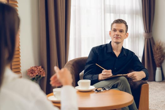 Psychological consultation gaining improvement on mental problem, happy young female patient doing therapy session while psychiatrist making diagnostic on mental illness. Unveiling