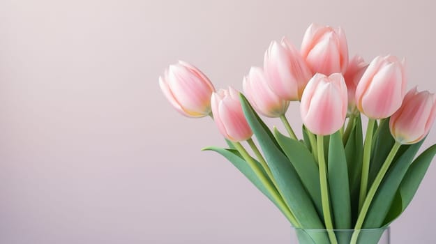 Pink tulips flowers on pastel pink background. Spring and easter greeting card design layout. Flat lay, top view, copy space. High quality photo