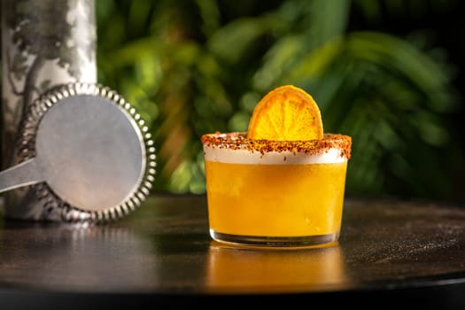 Luxury cocktail on the wooden table on a dark background