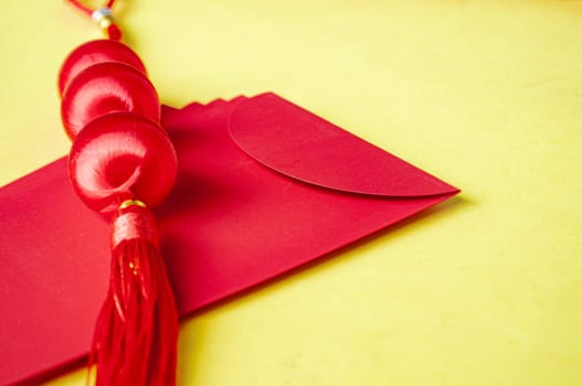Side view of Chinese New Year red packet with customizable space for text or wishes. Chinese New Year celebration concept