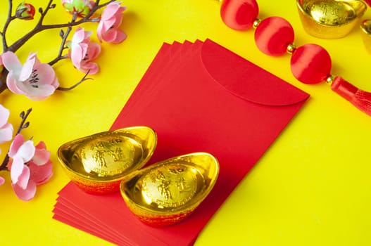 Top view of Chinese New Year decoration decoration on yellow cover background.