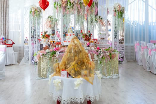 The table of brides and grooms at a gypsy wedding. Ukraine, Vinnytsia, August 10, 2021