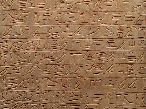 old egypt hieroglyphs carved on the stone.