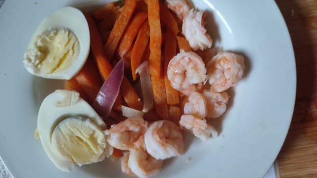 food boiled eggs, shrimp and sweet potato plate, lunch dinner cooking breakfast. High quality photo