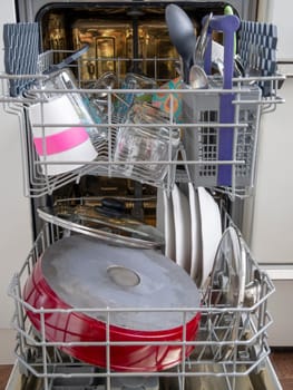 Open dishwasher with clean dishes