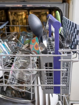 Open dishwasher with clean dishes