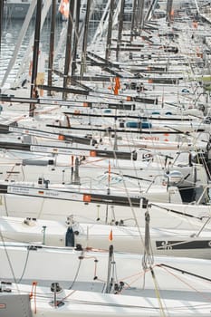 Monaco, Monte-Carlo, 18 October 2022: many sailing boats of the World Championship of J70 class participants stand in a row waiting for the wind for the stage of the sailing race. High quality photo