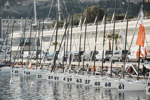 Monaco, Monte-Carlo, 18 October 2022: many sailing boats of the World Championship of J70 class participants stand in a row waiting for the wind for the stage of the sailing race. High quality photo