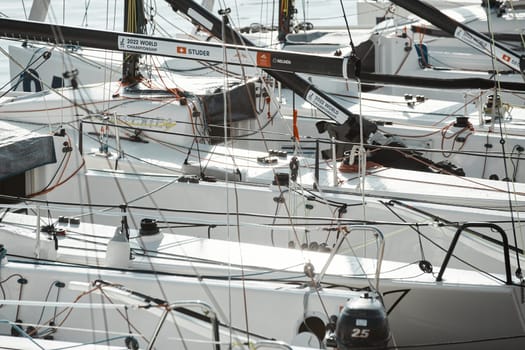 Monaco, Monte-Carlo, 18 October 2022: many sailing boats of the World Championship of J70 class participants stand in a row waiting for the wind for the stage of the sailing race. High quality photo