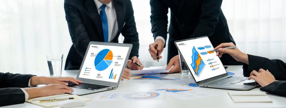 Business people in group meeting in formal attire share idea discussing report for company profit in creative workspace for start up business shot in close up view on group meeting table . Oratory .