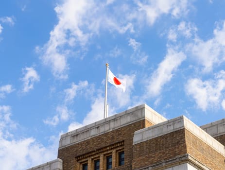 Tokyio, Japan. January 2024. the Japanese flag flying atop the National Museum of Science and Nature in the city center