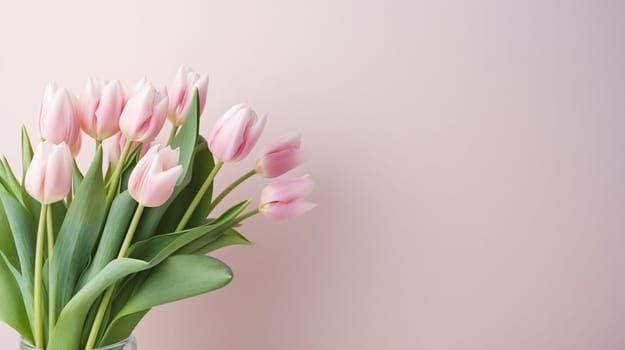 Pink tulips flowers on pastel pink background. Spring and easter greeting card design layout. Flat lay, top view, copy space. High quality photo