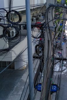 Tangle of Electrical Wires on Power Pole