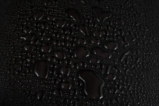 Water drops on black background
