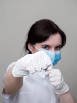 women in medical gloves box, home quarantine, coronavirus pandemic, on a white background, the fight against the virus