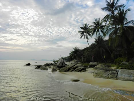 Beautiful coast with azure water cliffs and green jungle on Koh Phangan. Thailand