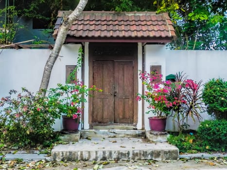 old wooden door decorated with flowers.
