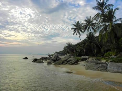 Beautiful coast with azure water cliffs and green jungle on Koh Phangan. Thailand