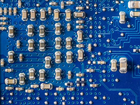 Close up of a printed blue computer circuit board