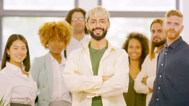 Photo of a leader and teamwork smiling at camera and standing proud