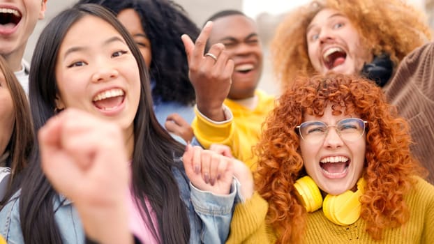 Multiethnic excited friends dancing together in a festival