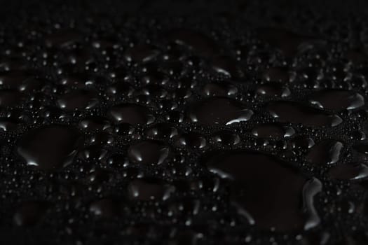 Water drops on black background