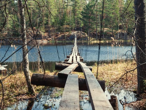old suspension bridge over the lake.