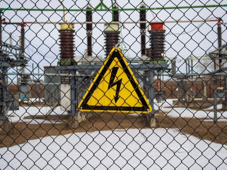 high voltage warning sign on high-voltage substation
