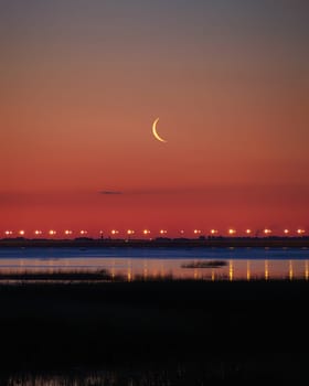 Sunset or sunrise with clouds . Red sunset and moon . beautiful sky . Prayer time . Generous Ramadan . Mubarak background .