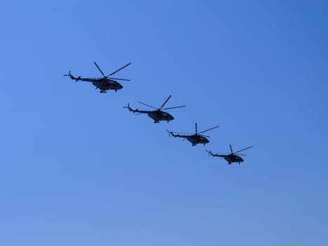 Russia, St. Petersburg - June 24, 2020: Russian military helicopters Mi-8 of the Russian Air Force in flight at the Victory Parade in World War II.