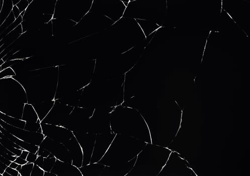Texture of broken glass on a black background.