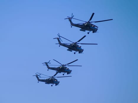 Russia, St. Petersburg - June 24, 2020: Russian military helicopters Mi-28 of the Russian Air Force in flight at the Victory Parade in World War II.