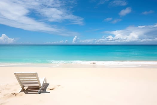 Tranquil beach scene with a single chair facing the serene turquoise ocean