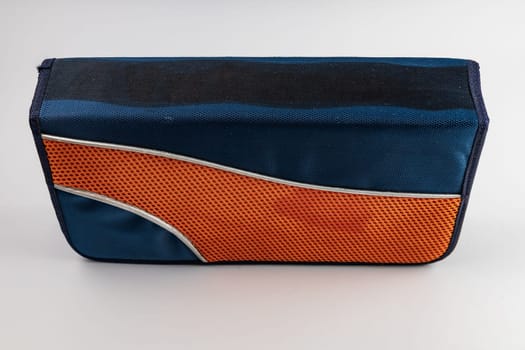 Colorful and empty CD or DVD case made by colorful blue and orange fabric