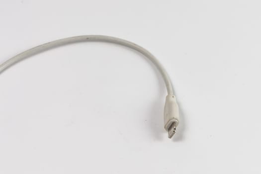 Long white cable with Lightning connector at the end for iPhone chargers
