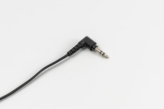 Long black cable of headphones with microjack connector at the end