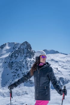 Woman skiing with pink trousers in Formigal, Spain