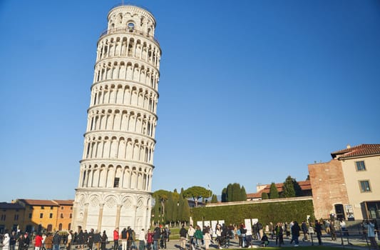 Pisa, Italy - 13.02.2023: View of the Leaning Tower of Pisa on a sunny day in the city of Pisa, Italy.