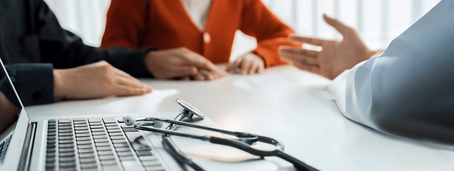 Couple attend fertility or medical consultation with gynecologist at hospital as family planning care for pregnancy. Husband and wife consoling each other through doctor appointment. Panorama Rigid