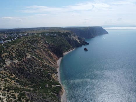 Aerial panoramic view of beautiful sunset above sea. Beautiful seascape. Sun glare, small waves on the water surface. Evening. Horizon. Nobody. No people. Copy space. Never-ending beauty of nature