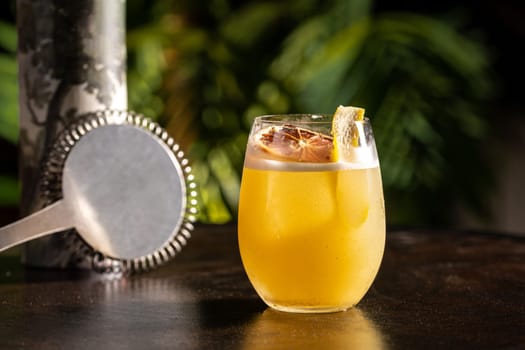 Luxury cocktail on the wooden table on a dark background